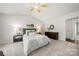 Inviting primary bedroom with a vaulted ceiling, a dresser, and two bedside tables at 4507 Mackinac St, Charlotte, NC 28269