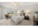 Inviting primary bedroom featuring vaulted ceiling, a chair, and ample natural light at 4507 Mackinac St, Charlotte, NC 28269