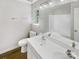 Bathroom with dual-sink vanity, and a tub/shower combo in a modern setting at 5163 Ficus Tree Ln, Charlotte, NC 28215