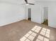 Inviting bedroom with neutral carpet, ceiling fan and access to ensuite bathroom at 5163 Ficus Tree Ln, Charlotte, NC 28215