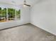 Bright bedroom with large window offering ample natural light and scenic views at 5163 Ficus Tree Ln, Charlotte, NC 28215