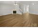 Spacious living room featuring a cozy fireplace and ample natural light at 5163 Ficus Tree Ln, Charlotte, NC 28215