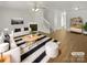 Bright living room with fireplace, modern furniture, and stylish decor accents at 5163 Ficus Tree Ln, Charlotte, NC 28215