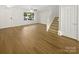 Open living room with staircase and lots of natural light at 5163 Ficus Tree Ln, Charlotte, NC 28215