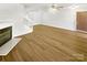 Inviting living room with cozy fireplace, modern flooring, and ample space at 5163 Ficus Tree Ln, Charlotte, NC 28215