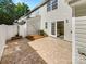 Back patio features patterned pavers and a charming privacy fence, perfect for outdoor relaxation at 5163 Ficus Tree Ln, Charlotte, NC 28215