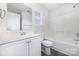 Well-lit bathroom features a vanity, a toilet, and a bathtub with a shower, offering comfort and practicality at 5233 Halverson Ct, Kannapolis, NC 28083