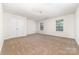 Large carpeted bedroom offers ample natural light, a flush mount light fixture, and a closet at 5233 Halverson Ct, Kannapolis, NC 28083