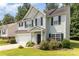 Charming two-story home with light green siding, black shutters, and a well-manicured lawn at 5233 Halverson Ct, Kannapolis, NC 28083