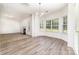 Open-concept living area with modern flooring, natural light, and a cozy fireplace at 5233 Halverson Ct, Kannapolis, NC 28083