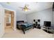 Cozy bedroom featuring a comfortable bed, neutral walls, and a shelving unit for storage at 6309 Chamar Cir, Kannapolis, NC 28081