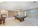 Spacious game room with pool table and two chairs offering ample space for recreation at 6309 Chamar Cir, Kannapolis, NC 28081
