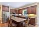 Stylish kitchen featuring stainless steel appliances, an island, and ample cabinet space at 6309 Chamar Cir, Kannapolis, NC 28081