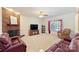 Spacious living room featuring a brick fireplace, neutral carpet and comfortable furniture at 6309 Chamar Cir, Kannapolis, NC 28081