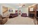 Comfortable living room with carpet, fireplace, and staircase, ideal for relaxation and gatherings at 6309 Chamar Cir, Kannapolis, NC 28081