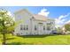 Well-maintained backyard featuring a spacious lawn and the exterior of the house at 7737 Pleasant Valley Dr, Harrisburg, NC 28075