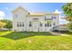 Spacious backyard with lush lawn and home exterior, great for entertainment and recreation at 7737 Pleasant Valley Dr, Harrisburg, NC 28075