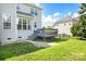 Backyard view with a deck and green lawn perfect for outdoor activities and relaxation at 7737 Pleasant Valley Dr, Harrisburg, NC 28075