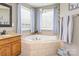 Bright bathroom with a soaking tub at 7737 Pleasant Valley Dr, Harrisburg, NC 28075