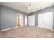 Neutral bedroom featuring carpeted floors, ceiling fan, closet, and bathroom access at 7737 Pleasant Valley Dr, Harrisburg, NC 28075