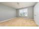 Neutral bedroom with carpet flooring and a window at 7737 Pleasant Valley Dr, Harrisburg, NC 28075