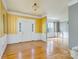 Bright foyer features hardwood floors, elegant trim, and a welcoming entrance at 7737 Pleasant Valley Dr, Harrisburg, NC 28075