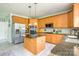 Bright kitchen features stainless steel appliances, granite countertops, and a functional center island at 7737 Pleasant Valley Dr, Harrisburg, NC 28075