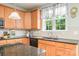 Kitchen area features granite counters and a stainless sink at 7737 Pleasant Valley Dr, Harrisburg, NC 28075