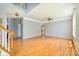 Open floor plan with hardwood floors, neutral walls, and ample natural light at 7737 Pleasant Valley Dr, Harrisburg, NC 28075