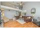 Great room with vaulted ceiling, hardwood floors, and open layout to kitchen at 7737 Pleasant Valley Dr, Harrisburg, NC 28075