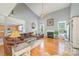 Open living room with hardwood floors, fireplace and natural light at 7737 Pleasant Valley Dr, Harrisburg, NC 28075