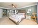 Well decorated main bedroom featuring a king bed and en suite bathroom at 7737 Pleasant Valley Dr, Harrisburg, NC 28075