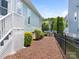 Fenced backyard with fresh mulch and landscaping at 8918 Cotton Press Rd, Charlotte, NC 28277