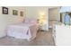 Cozy bedroom featuring a bed, bedside table, and white dresser at 8918 Cotton Press Rd, Charlotte, NC 28277
