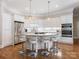 Modern kitchen features a large island, stainless steel appliances, and ample storage at 8918 Cotton Press Rd, Charlotte, NC 28277