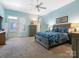 Spacious main bedroom with blue walls and plush carpet at 8918 Cotton Press Rd, Charlotte, NC 28277