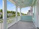 Spacious porch with white railings offering neighborhood views at 8918 Cotton Press Rd, Charlotte, NC 28277