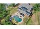 Bird's eye view of a private backyard oasis, complete with a custom pool, patio, and beautifully manicured landscaping at 101 Cross Current Ln, Belmont, NC 28012