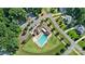 Aerial view of a community pool and clubhouse with ample parking and surrounding greenery at 101 Cross Current Ln, Belmont, NC 28012
