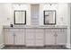 Bathroom with dual vanity, custom storage, granite countertops, and modern lighting fixtures at 101 Cross Current Ln, Belmont, NC 28012