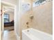 Bright bathroom featuring tiled shower and a view into the adjacent bedroom at 101 Cross Current Ln, Belmont, NC 28012