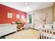 Charming Bedroom with colorful wall art, hardwood floors, and a white crib at 101 Cross Current Ln, Belmont, NC 28012