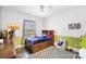 Cozy bedroom with a built-in bed, playful decor, and a checkered area rug at 101 Cross Current Ln, Belmont, NC 28012