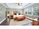 Stylish bedroom featuring hardwood floors, patterned wallpaper, and a cozy seating bench at 101 Cross Current Ln, Belmont, NC 28012