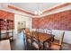 Formal dining room featuring hardwood floors, stylish wallpaper, and a chandelier at 101 Cross Current Ln, Belmont, NC 28012