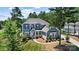 Lovely two-story home with a welcoming front porch, well-maintained lawn, and mature trees in the yard at 101 Cross Current Ln, Belmont, NC 28012