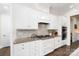 Kitchen featuring white cabinetry, stainless steel appliances, and tile backsplash at 101 Cross Current Ln, Belmont, NC 28012
