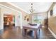 Versatile living room with hardwood flooring and adjacent bonus area. Ideal for recreation and relaxation at 101 Cross Current Ln, Belmont, NC 28012