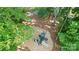 Aerial view of a well-maintained community playground with slides, climbing structures, and soft landing surfaces at 101 Cross Current Ln, Belmont, NC 28012