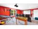 Large recreation room featuring a foosball table, projector screen, and theater seating at 101 Cross Current Ln, Belmont, NC 28012